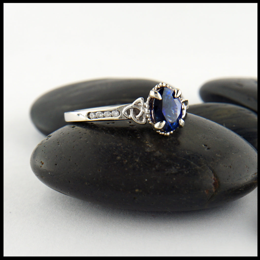 profile view of custom sapphire trinity ring