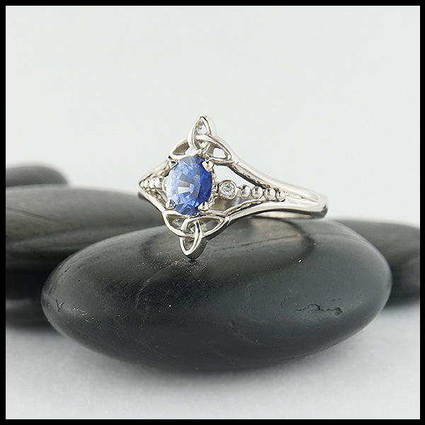 Custom 14K White Gold Celtic Trinity Knot ring, set with a genuine Blue Sapphire stone and two .04ct diamonds. 