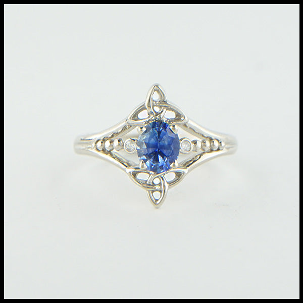 Custom 14K White Gold Celtic Trinity Knot ring, set with a genuine Blue Sapphire stone and two .04ct diamonds. 