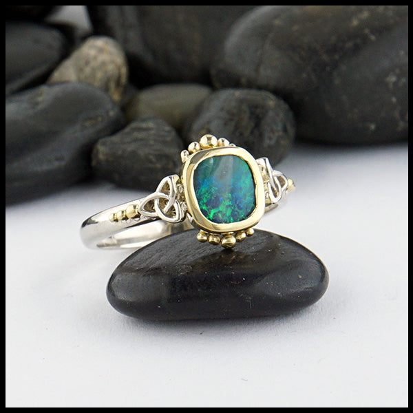 Opal trinity ring with 0.54ct Black Opal and 14K White trinity accents and 18K Yellow Gold. 