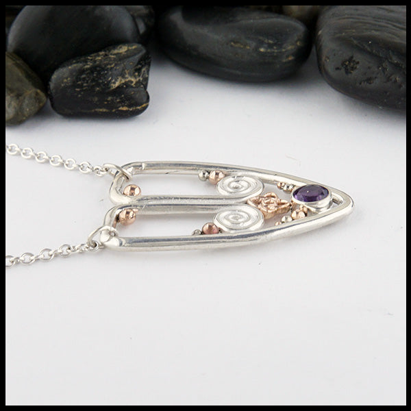 Profile view of Sterling Silver necklace set with Amethyst, featuring spirals and beads in 14K Rose & White Gold. Pendant attached to 16" cable chain. 