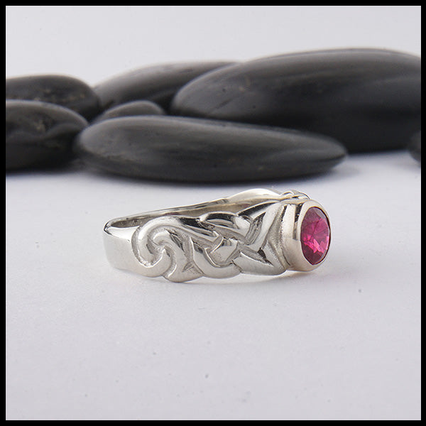 profile view of custom ban tigherna ring in white gold with ruby