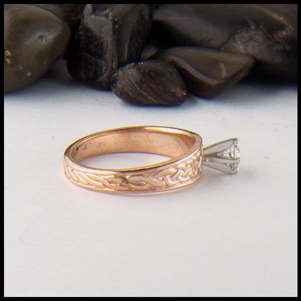 Profile view of Celtic knot ring with reclaimed diamond