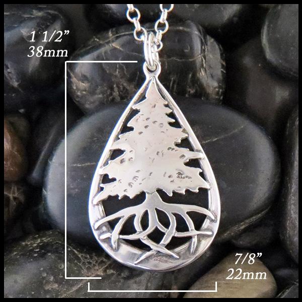 pine tree pendant in sterling silver measures 1 1/2" by 7/8"