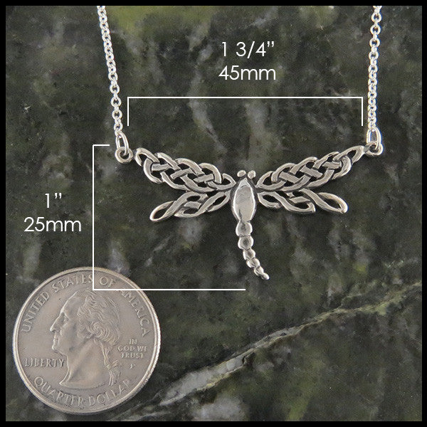 dragonfly pendant in silver measures 1" by 1 3/4"
