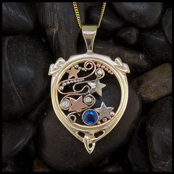 Starry sapphire and diamond pendant in gold