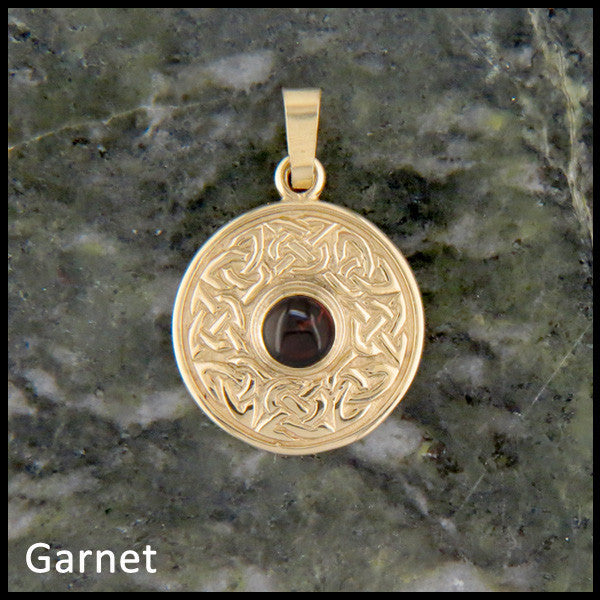 Wheel of life pendant with Garnet