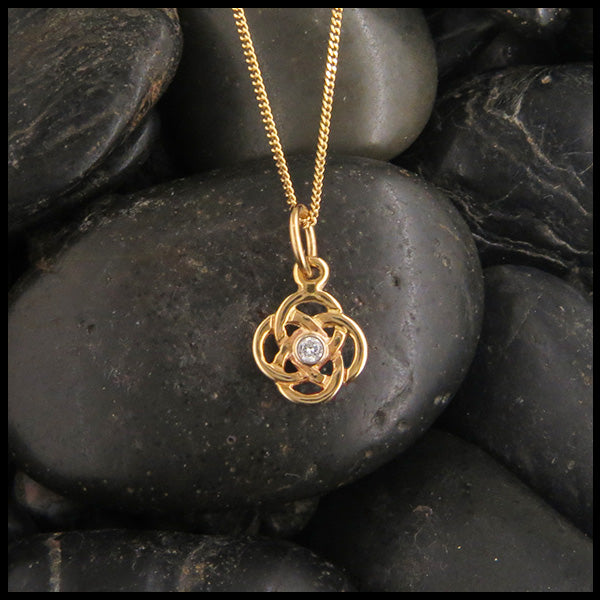 Simple Celtic gold pendant with diamond