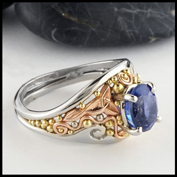 Profile view of Custom frame ring in gold with Ceylon Sapphire
