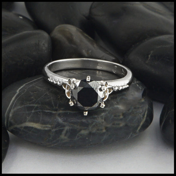 black diamond ring with trinity knot