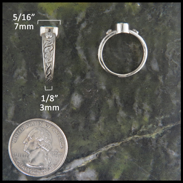 Two White Gold rings on green marble with quarter for scare. 7mm x 3mm
