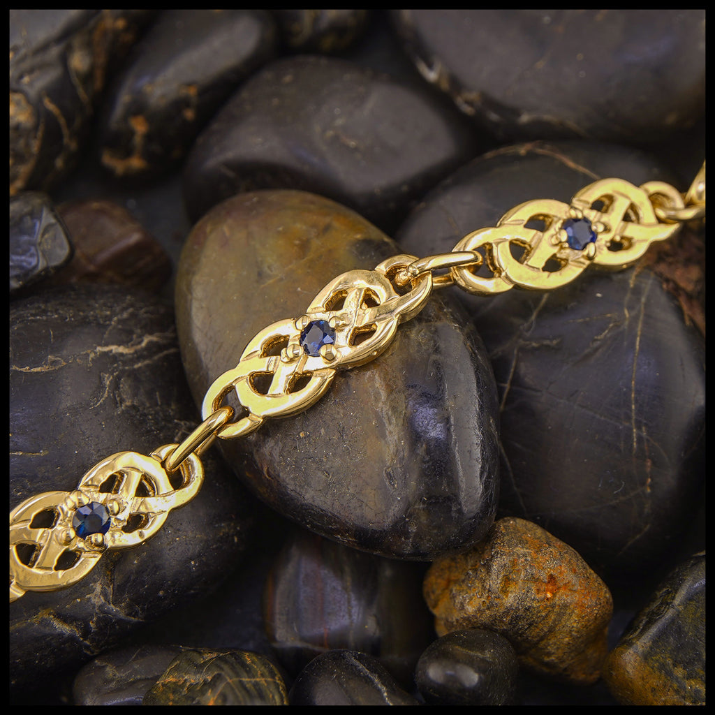 Gold Josephine's Knot link bracelet with Sapphires