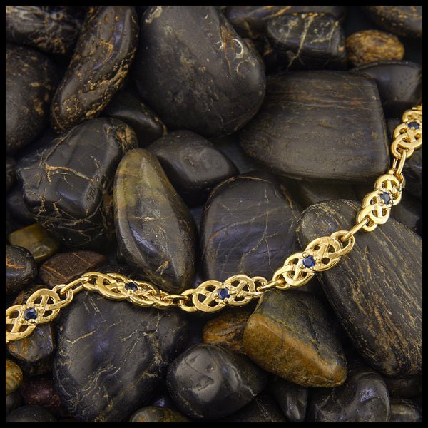 Gold Josephine's Knot link bracelet with Sapphires