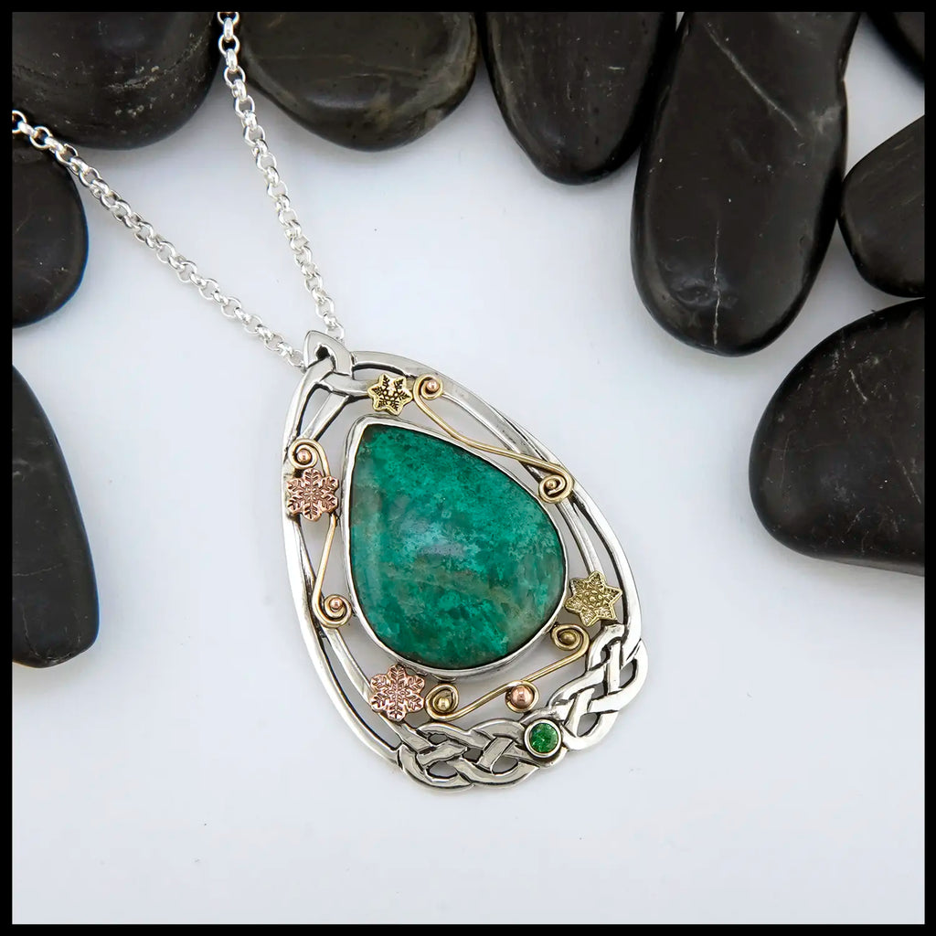 Chrysocolla and Tsavorite stones set in a custom Sterling Silver Frame, with gold accents