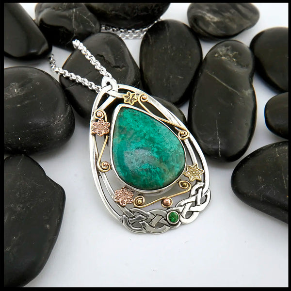 Chrysocolla and Tsavorite stones set in a custom Sterling Silver Frame, with gold accents