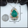 Chrysocolla and Tsavorite stones set in a custom Sterling Silver Frame, with gold accents 50mmx 32mm