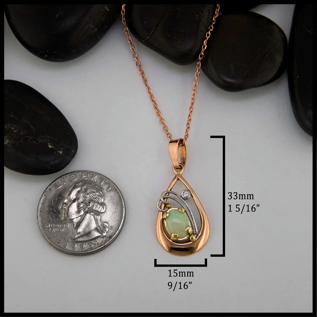 Opal and Diamond set Pendant in 14KR
33mmx15mm