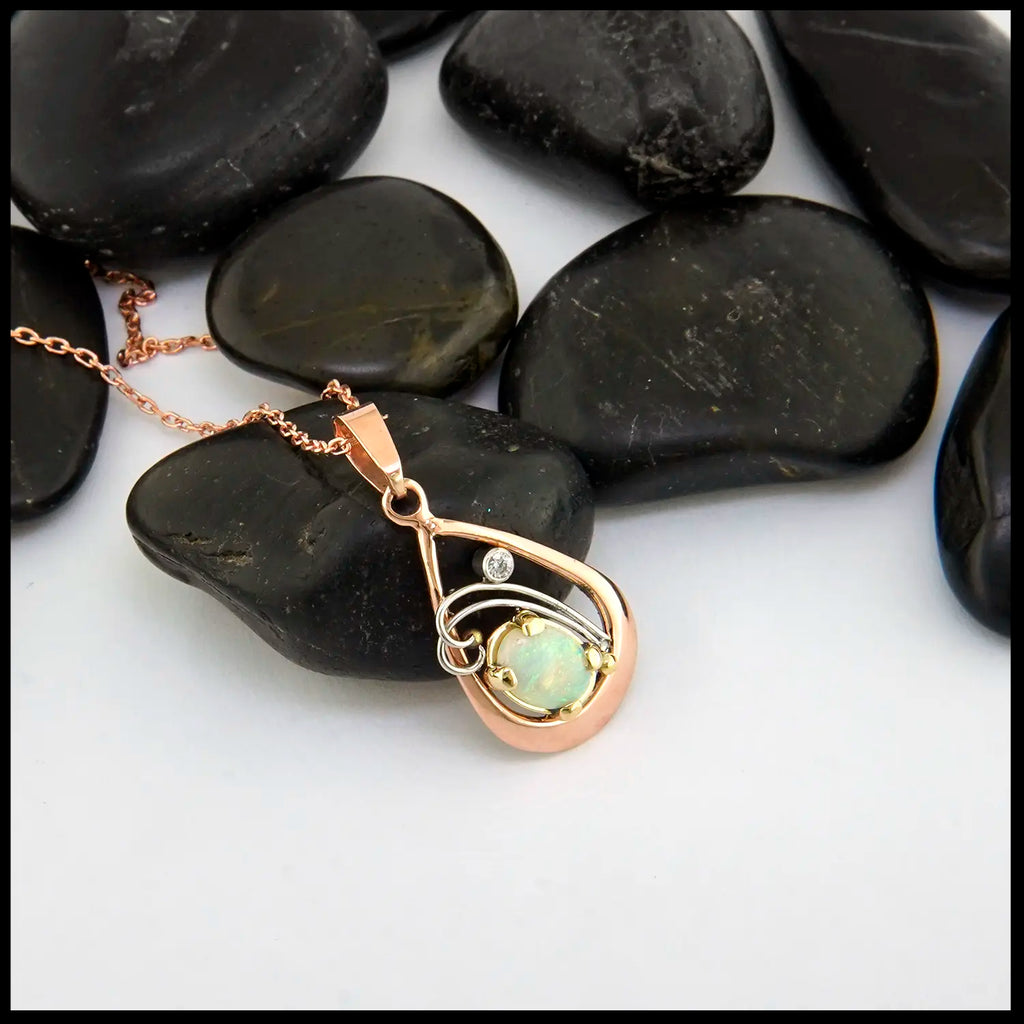 Opal and Diamond set Pendant in 14KR