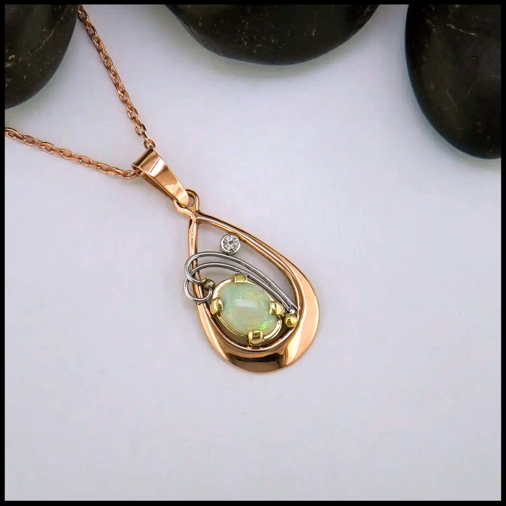 Opal and Diamond set Pendant in 14KR