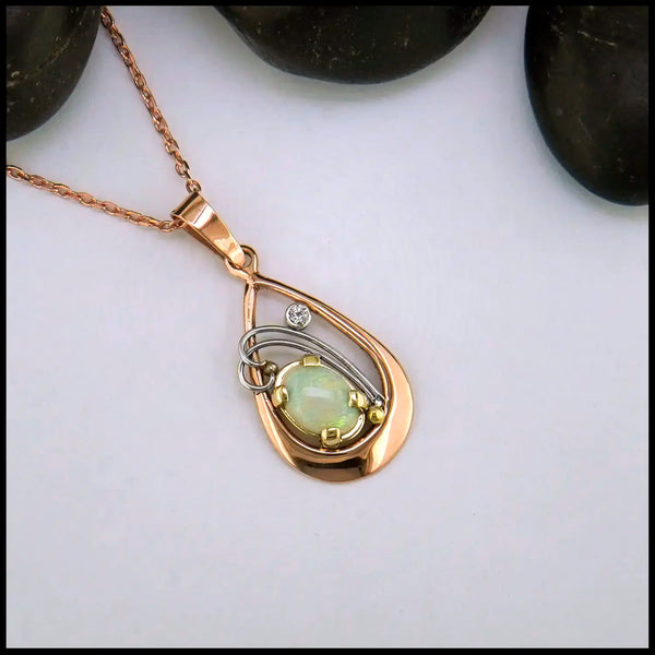 Opal and Diamond set Pendant in 14KR