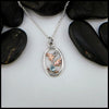 4mm Blue Topaz set in Sterling Silver  Pendant with 14K Rose Gold accents