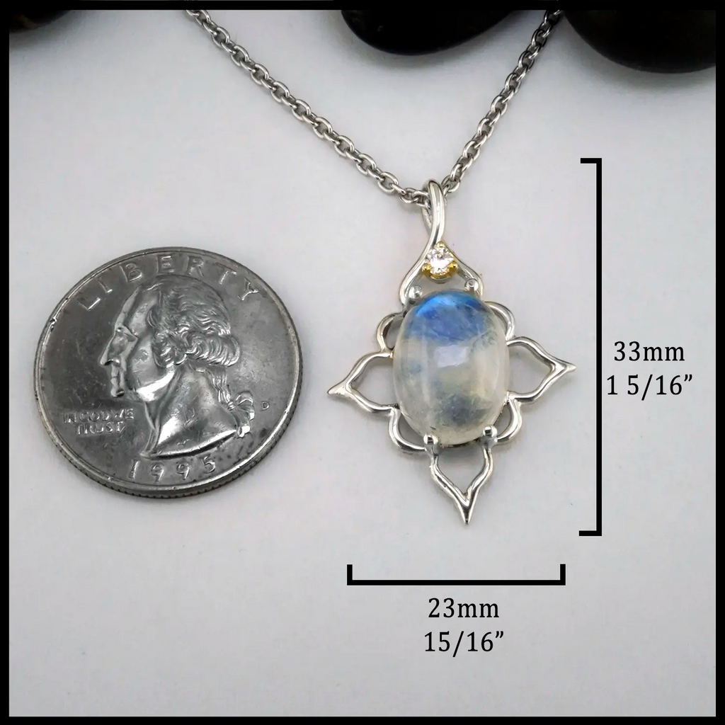 Moonstone and Diamond Pendant set in Sterling Silver and 14K yellow Gold
33mm x 23mm