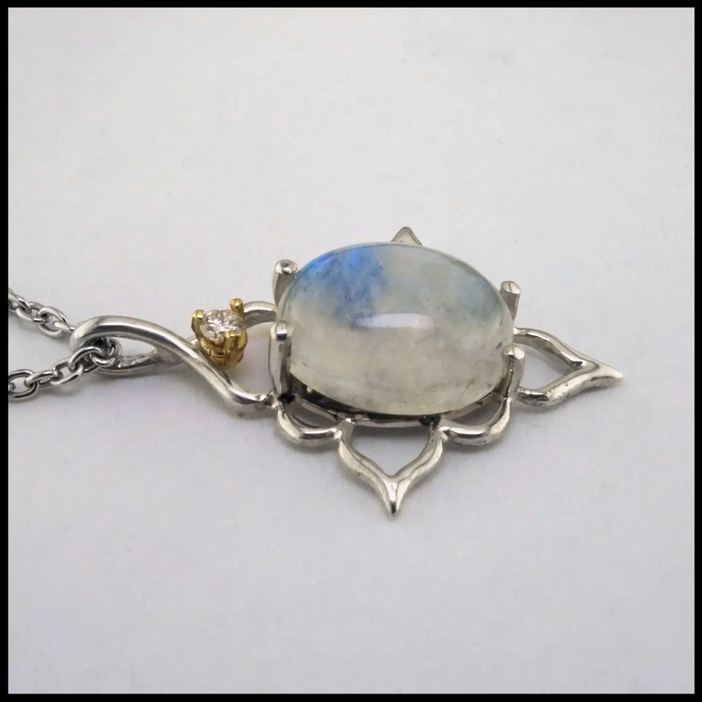 Moonstone and Diamond Pendant set in Sterling Silver and 14K yellow Gold