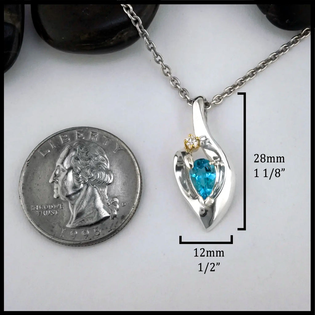 Blue Topaz and Diamond Pendant set in Sterling Silver and 14K Gold
28mm x 12mm