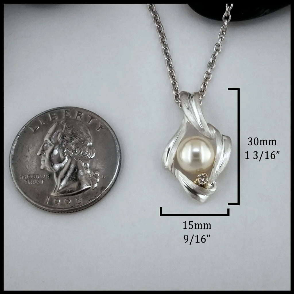 Pearl and Diamond Pendant set in Sterling Silver and 14K Rose Gold
30mm x 15mm