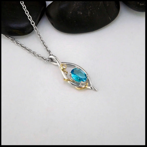 Blue Topaz and Diamond Pendant set in Sterling Silver