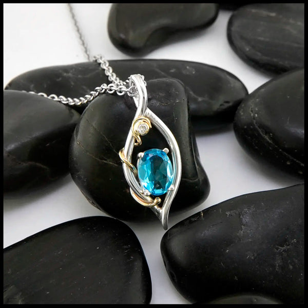 Blue Topaz and Diamond Pendant set in Sterling Silver