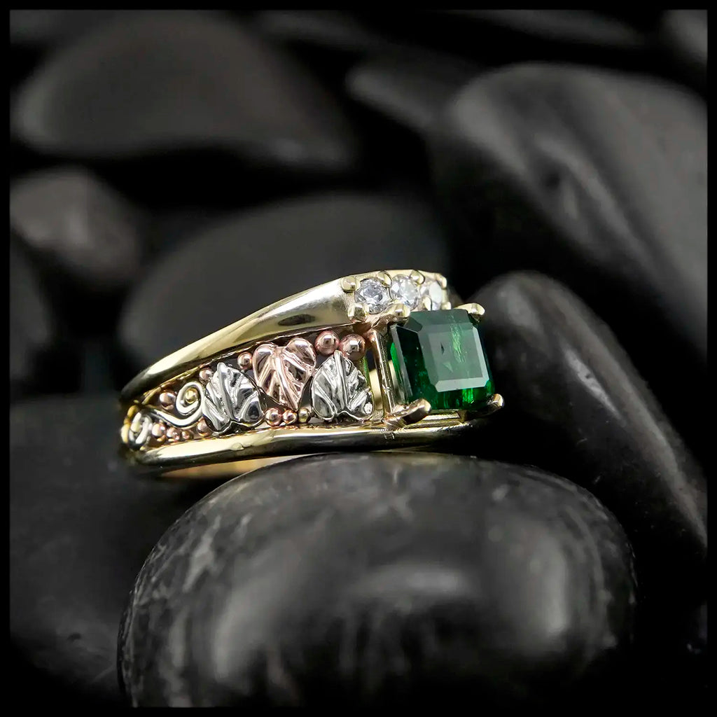 Emerald and Diamond frame ring in 14K Yellow, Rose and white gold.