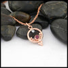 Celtic Ruby and Diamond Pendant in 14K Rose Gold