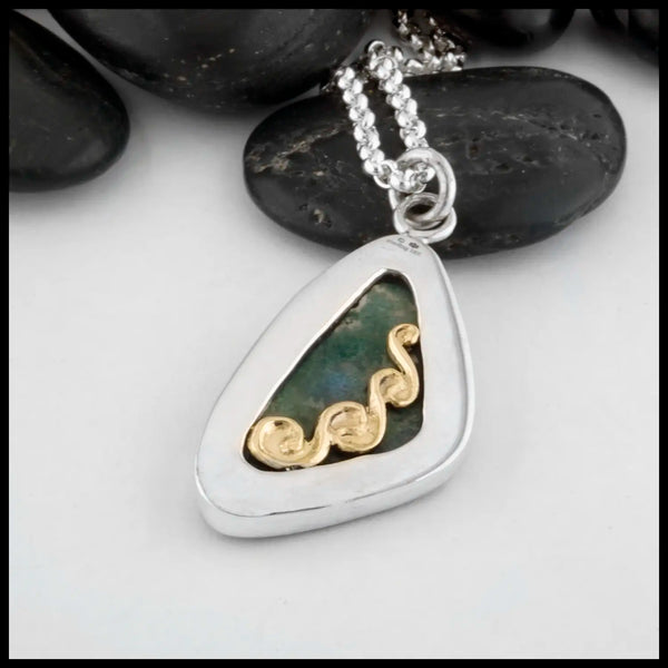  The backside of the custom Sterling Silver Bezel is decorated with a 14 Karat Yellow Gold climbing spiral with the edges of the bezel. At the top of the bezel is our Makers Mark and the "Sterling Silver" and "14K" stampings.