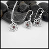 This lovely Limited Edition Set combines the Trinity Knot Heart drop earrings with its matching Pendant in Sterling Silver, both set with 4mm Rhodolite Garnets. This set includes 18" Cable Chain.