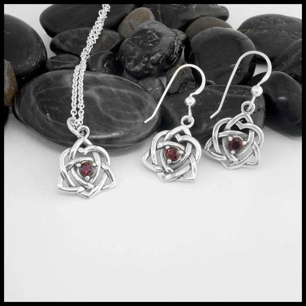 This lovely Limited Edition Set combines the Trinity Knot Heart drop earrings with its matching Pendant in Sterling Silver, both set with 4mm Rhodolite Garnets. This set includes 18" Cable Chain.
