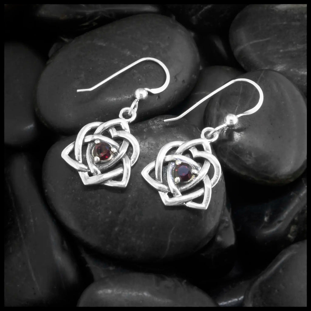 These lovely Limited Edition Trinity Knot Heart drop earrings in Sterling Silver, set with 4mm Rhodolite Garnets. 