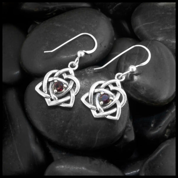 These lovely Limited Edition Trinity Knot Heart drop earrings in Sterling Silver, set with 4mm Rhodolite Garnets. 