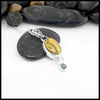 Necklace with a pendant featuring Bumblebee Jasper and Evergreen Topaz on a white background