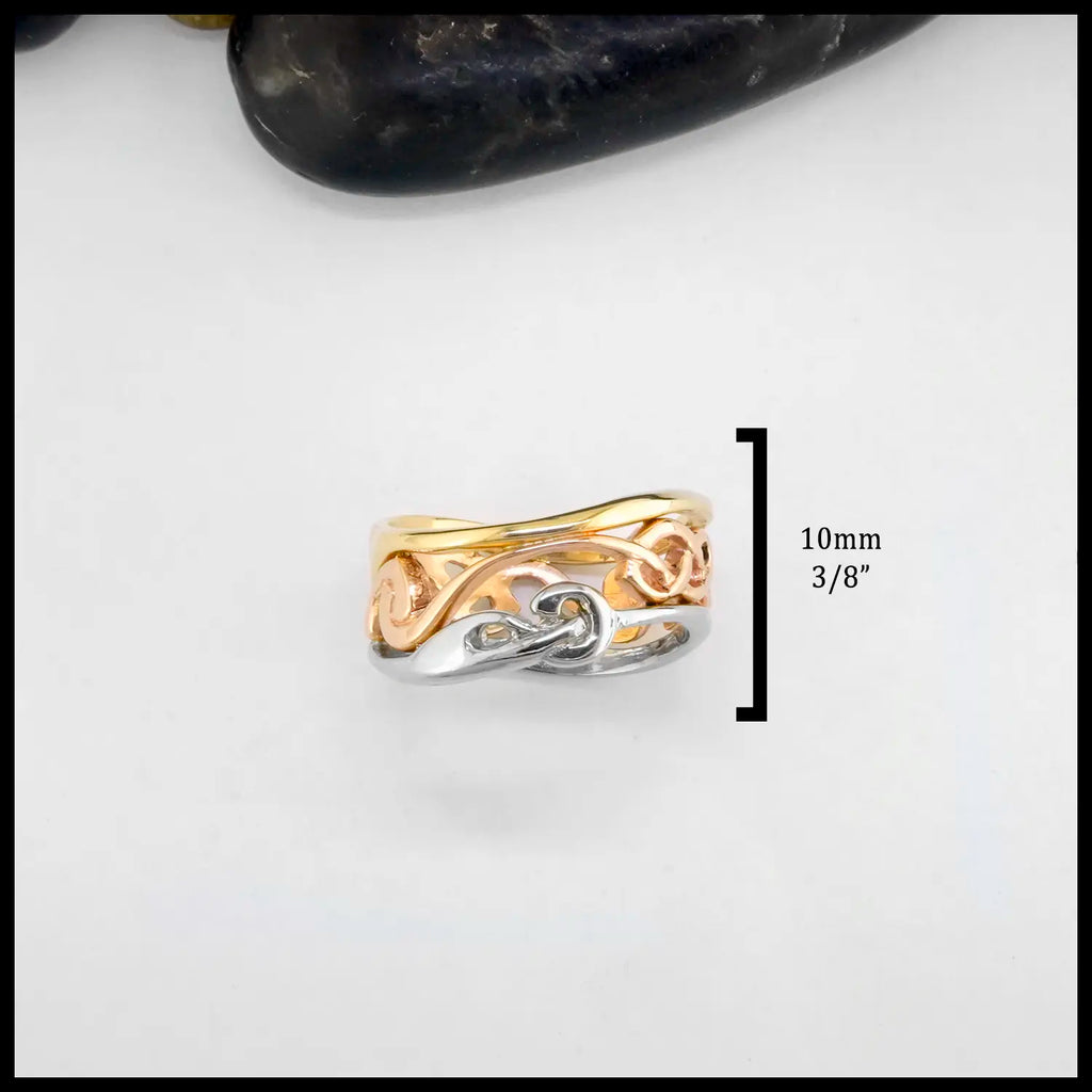 Tri-tone 14K Gold ring with interwoven design on a white background. Ring is approximately 10mm or 3/8".