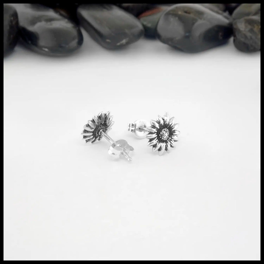 front and back view of the silver sunflower  post earrings.