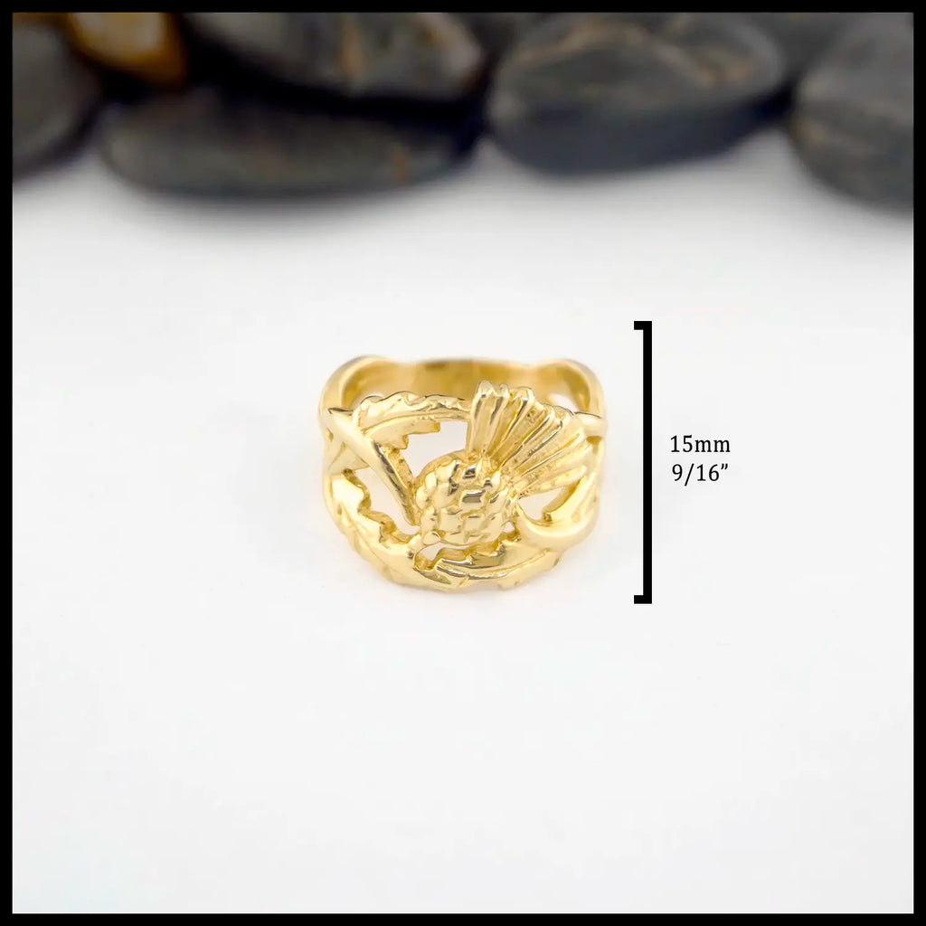 14K Yellow Gold ring with a Scottish Thistle design on a white background. Ring measures at 15mm or 9/16" on face and tappers to 7mm in the back.