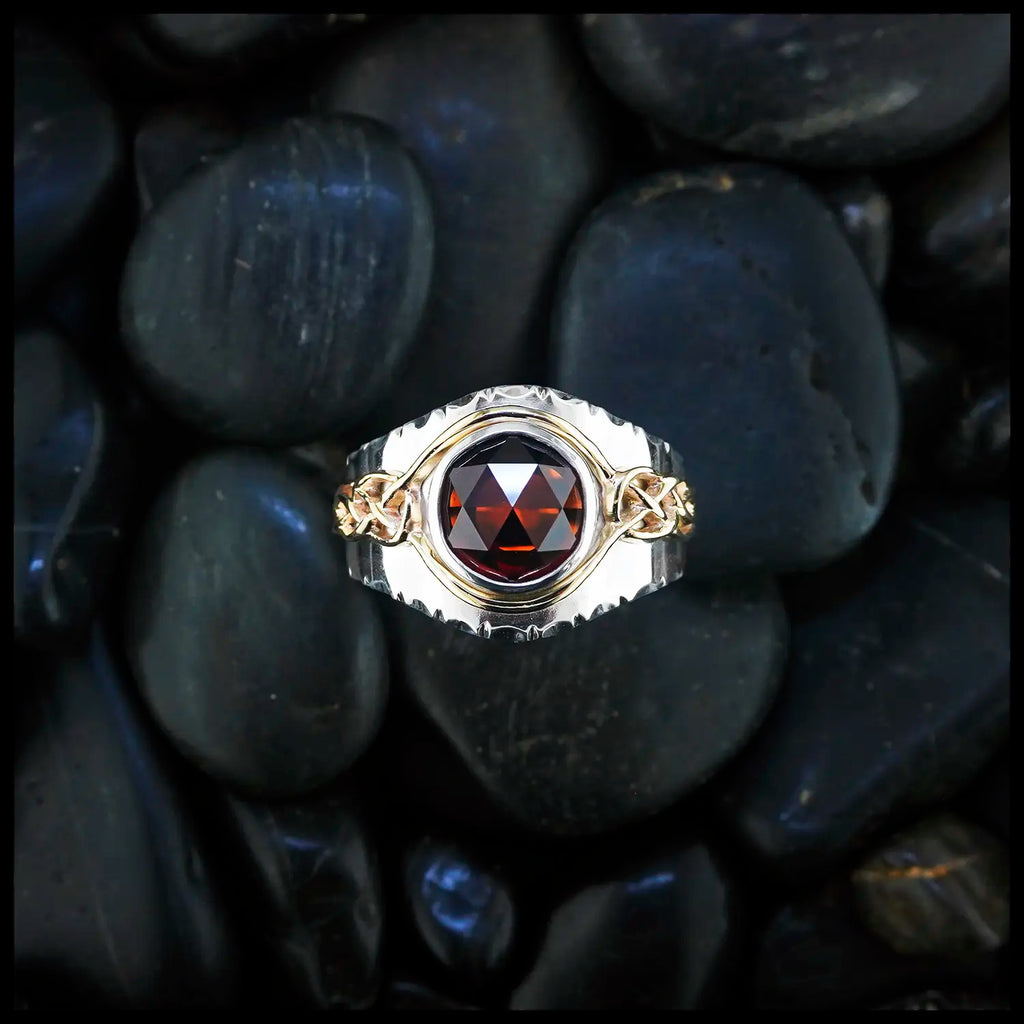Gold and Silver Mens Garnet ring on black stone background