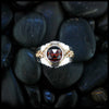 Gold and Silver Mens Garnet ring on black stone background