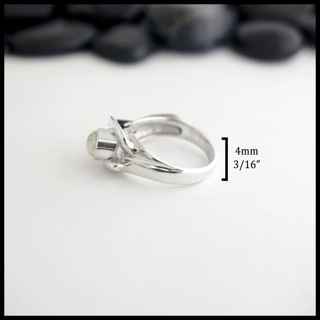 Silver ring with a Moonstone on a white background. measurements: 4mm or 3/16" Band