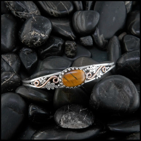 Tiger's Eye cuff bracelet set in a Sterling Silver Frame, with sterling silver oak leaves and beads and 14K rose gold-filled swirls.