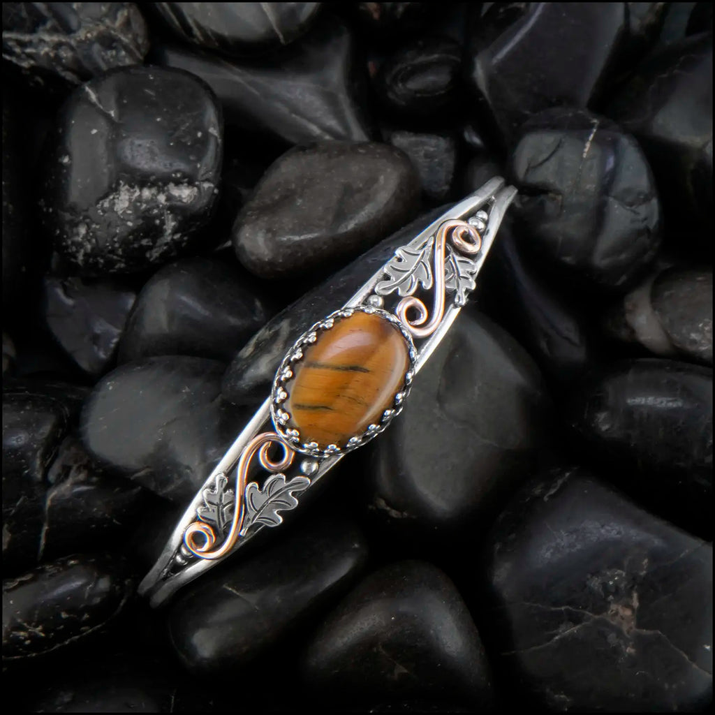 Tiger's Eye cuff bracelet set in a Sterling Silver Frame, with sterling silver oak leaves and beads and 14K rose gold-filled swirls.