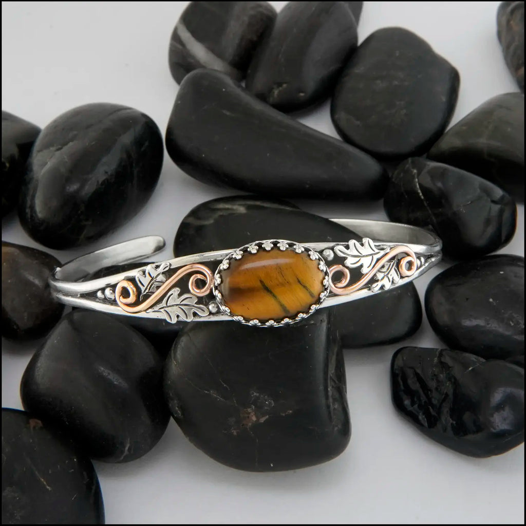 Tiger's Eye cuff bracelet set in a Sterling Silver Frame, with sterling silver oak leaves and beads and 14K rose gold-filled swirls.