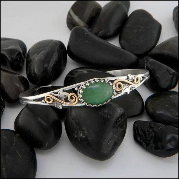 Aventurine cuff bracelet set in a Sterling Silver Frame, with sterling silver ivy leaves and beads and 14K yellow gold-filled swirls.