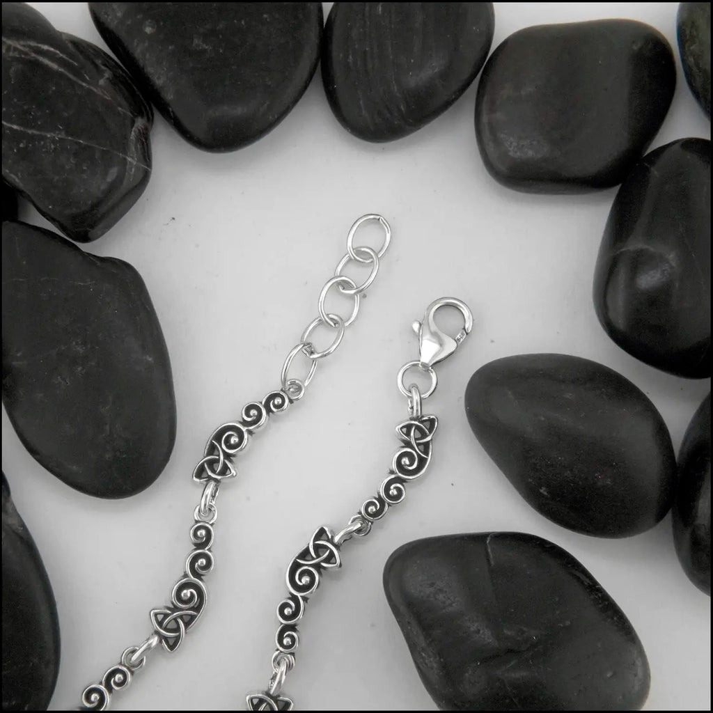 Spiral Trinity Scroll Link Bracelet, attached with a large lobster clasp and adjusting links